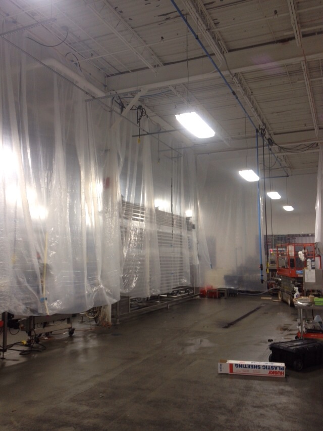 Specially seal off areas to be sprayed with dry fall paint in a commercial food manufacturer in Missouri