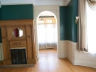 Interior-(-teal-room-w-doorway-and-fireplace