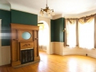 Interior-(-teal-room-with-fire-place-and-windows)